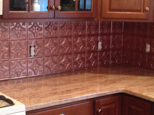 Copper colored tin backsplash